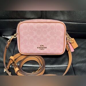 Coach Mini Carey Crossbody Bag In Signature Canvas With Charms in Powder Pink